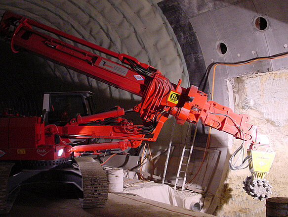 TML boom with rotary drum cutter being used in tunnel construction